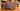 Iridescent Salmon Crocodile Clutch